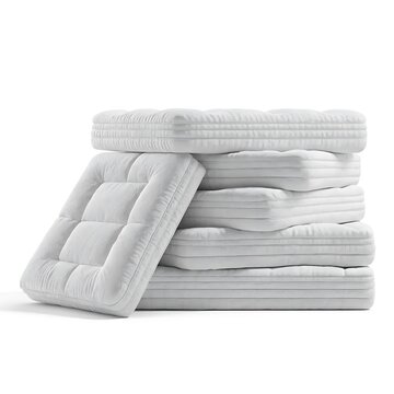 Stack of white quilted mattresses isolated on a white background with home decor