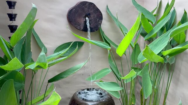 Exterior details of the luxury hotel featuring plant pots and small fountains