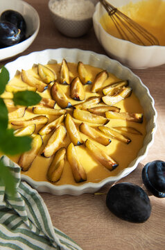 Preparing homemade plum tart for baking dessert