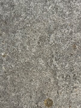 Graue raue Steinoberfl&auml;che als nat&uuml;rliche abstrakte Hintergrundtextur