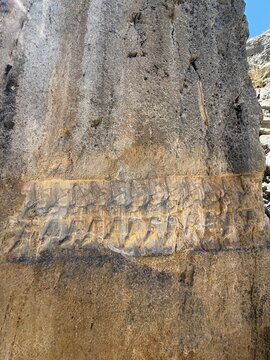 Ancient Stone Relief Carving of Figure on Temple Wall. Yazılıkaya was a sanctuary of Hattusa, the capital city of the Hittite Empire, today in the &Ccedil;orum Province, Turkey.