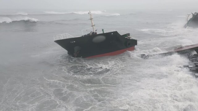 Powerful Storm Waves Crash Over Large Shipwreck Near Coast