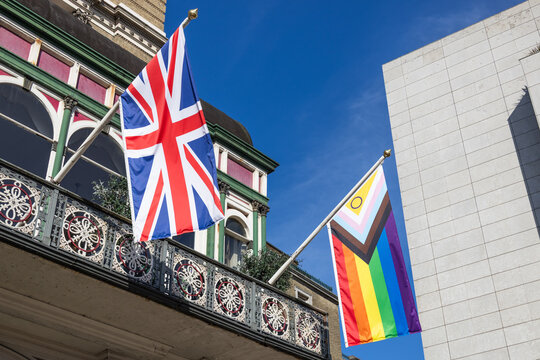 Union jack and progress pride flag on building