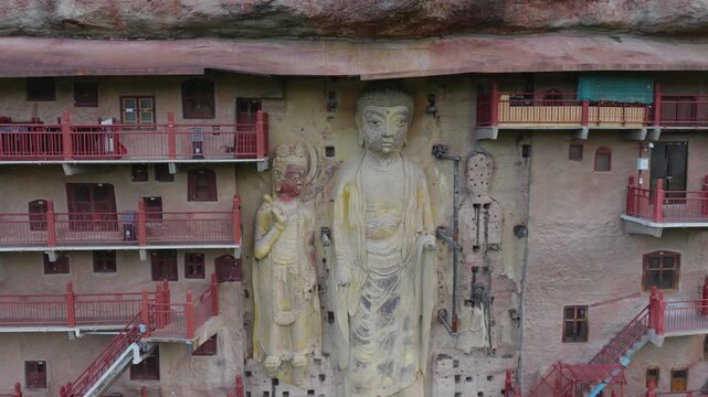 Close‑up aerial shot of exquisite Buddha statues at Maijishan Grottoes
Detailed rock‑cut Buddhist sculptures on the cliff of Maijishan