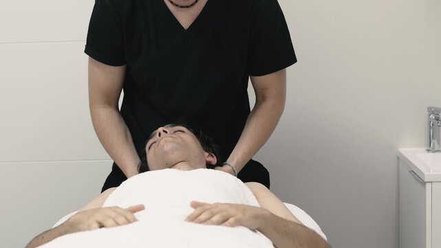 Physiotherapist performing a musculoskeletal assessment on a patient
