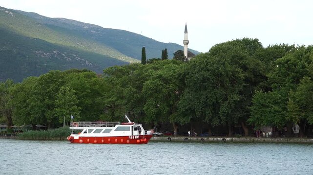 Urban Nature Landscape, Ioannina Lake Boat Transfering People From Island to City Center, Old City Nature and Aslan Pasha Mosque in Background