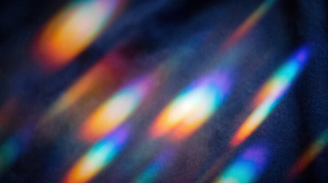 Abstract rainbow light refraction and prism caustic pattern on dark background for modern design concepts and futuristic tech backgrounds