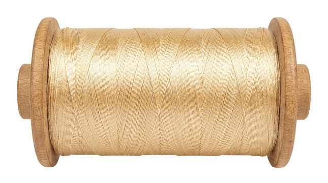 Vintage wooden spool with beige sewing thread, antique bobbin for tailoring and craft, rustic textile fiber on wood reel isolated PNG with Transparent Background