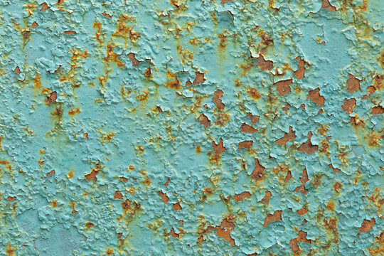 Textured background space for writing or design with wear and peeling paint showing blue and orange colors, peeling metal corrosion