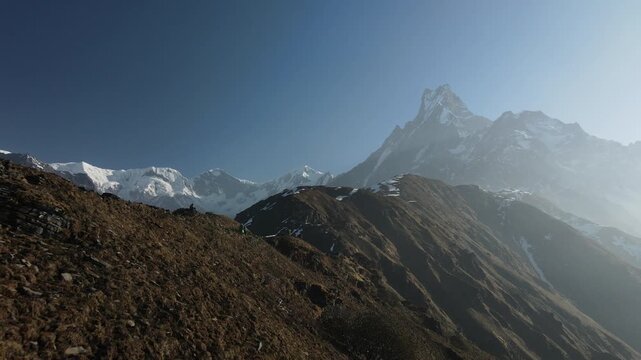 Drone footage of Mardi Himal at sunrise in Nepal, with spectacular views of Machhapuchhre, also known as Fishtail Mountain, and the surrounding Himalayas.