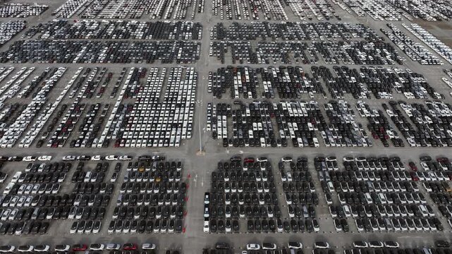 Aerial view new car lined up, Automobile automotive car parking lot commercial business industry, Port of import export business logistic dealership, New cars global business logistic import export.
