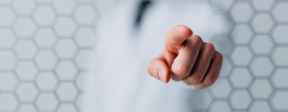 Human finger touching digital interface with white hexagonal pattern and copy space for futuristic technology and data visualization concepts