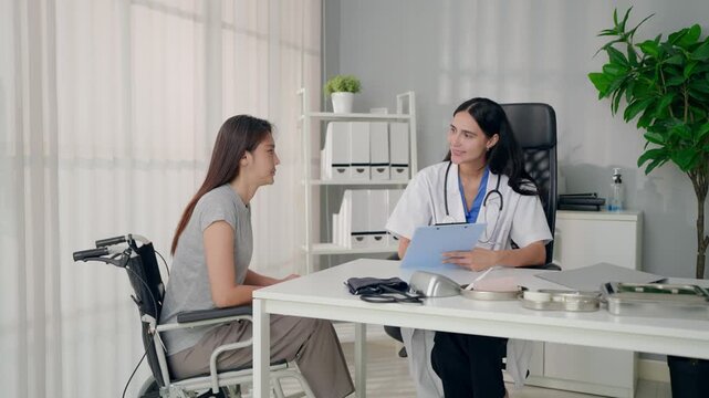 Female doctor consulting with patient in a modern examination room. 
