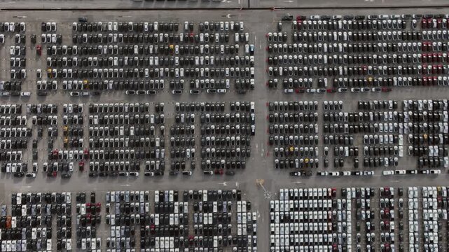 Aerial view new car lined up, Automobile automotive car parking lot commercial business industry, Port of import export business logistic dealership, New cars global business logistic import export.