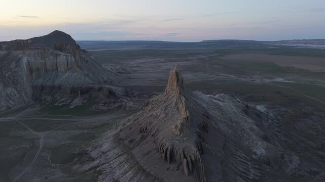 Aerial view of the dramatic limestone rock formations of the Bozzhyra tract at sunset in Aktau, Mangystau Region, Kazakhstan.