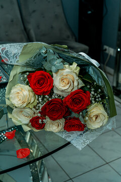 Elegant Bouquet of Red and White Roses on Glass Table for Valentine Day