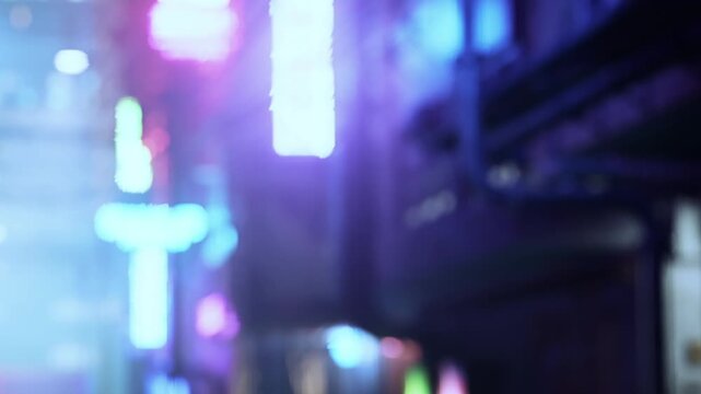 Bright lights illuminate a city street filled with colorful signs during the night. People walk by as the vibrant atmosphere captures the lively urban scene.