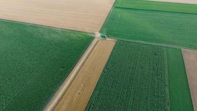 High aerial view of crop fields and farm machinery