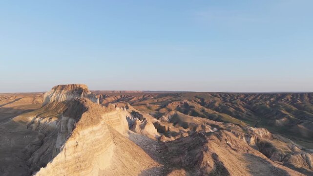 Aerial view of the rugged desert landscape and rocky cliffs of the Mangystau region in Aktau, Mangystau Region, Kazakhstan.