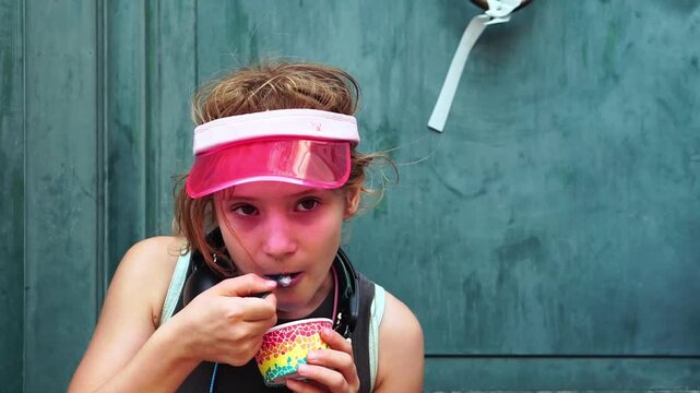 Young tourist eating blue ice cream in Bruges