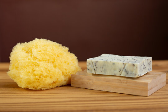 Natural herbal soap with scrub. Handmade soap bars on a wooden background. Space for text. 