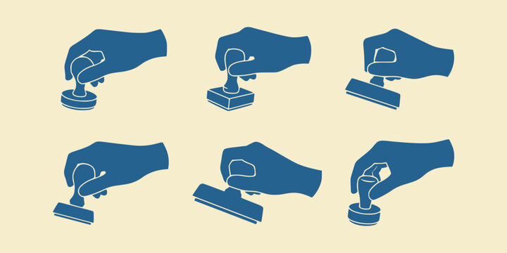 Set of hands holding rubber stamps isolated on beige background