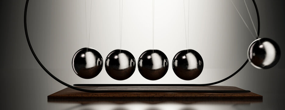 Newton's Cradle demonstrating kinetic energy transfer and conservation laws