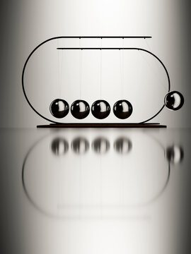 Newton's cradle with one ball in motion, demonstrating physics principles