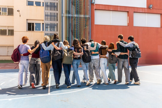 Diverse students walking together, embracing friendship and unity