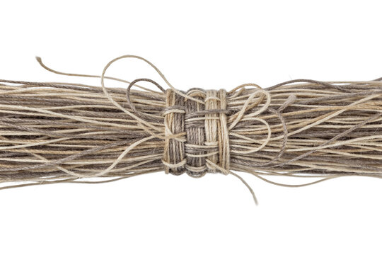 Natural jute twine bundle, rustic hemp string tied in a knot, brown organic fiber cordage for crafts and packaging isolated on white