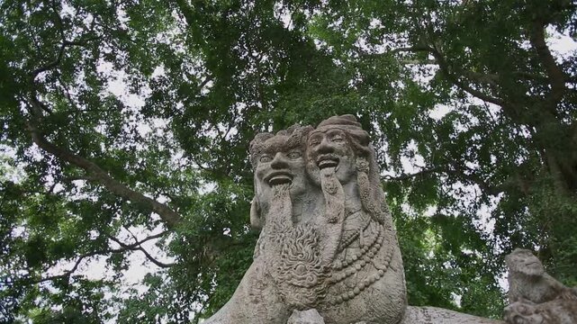 Weathered Balinese Stone Carving of Two-Headed Mythological Figure in Bali