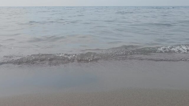 seascape in ulcinj montenegro with horizon and waves breaking along the shore video 80s style
