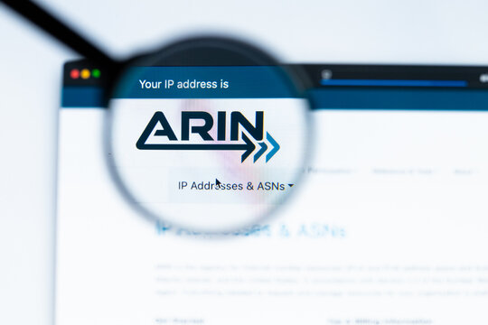 Milan, Italy 2026, 15 AGO Closeup of arin website page on a laptop screen. Focus on arin logo under a magnifying glass.