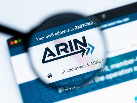 Milan, Italy 2026, 15 AGO Closeup of arin website page on a laptop screen. Focus on arin logo under a magnifying glass.