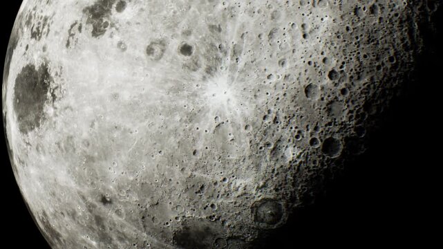 This shows a detailed part of the moon with visible craters and texture during a clear night. The dark sky surrounds the bright moon, highlighting its features.