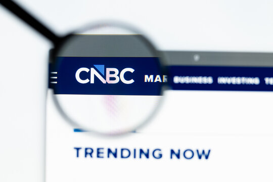 Milan, Italy 2026, 15 AGO Closeup of cnbc com website page on a laptop screen. Focus on cnbc com logo under a magnifying glass.