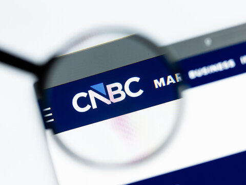 Milan, Italy 2026, 15 AGO Closeup of cnbc com website page on a laptop screen. Focus on cnbc com logo under a magnifying glass.