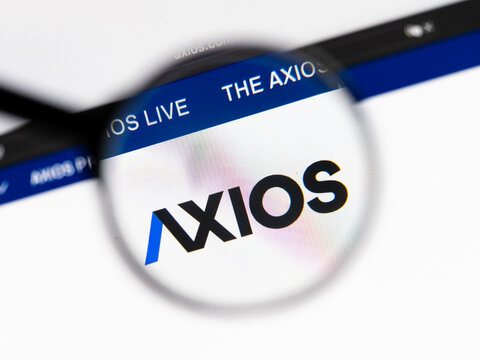 Milan, Italy 2026, 15 AGO Closeup of axios website page on a laptop screen. Focus on axios logo under a magnifying glass.