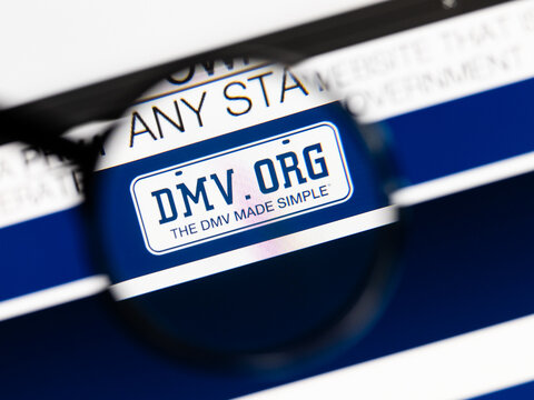 Milan, Italy 2026, 15 AGO Closeup of dmv website page on a laptop screen. Focus on dmv logo under a magnifying glass.
