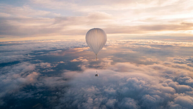 A weather balloon carrying a scientific payload rises above the clouds into the stratosphere at sunset. Concept of atmospheric research, meteorology forecasting, and near-space science.