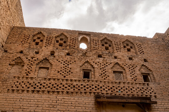 View of the intricate brickwork and historic arched windows of the ancient Erbil Citadel in Erbil, Erbil Governorate, Iraq.