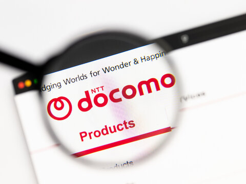 Milan, Italy 2026, 15 AGO Closeup of docomo website page on a laptop screen. Focus on docomo logo under a magnifying glass.