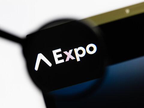 Milan, Italy 2026, 15 AGO Closeup of expo dev website page on a laptop screen. Focus on expo dev logo under a magnifying glass.
