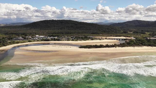 Maggies Beach aerial drone footage over the creek mouth and shoreline, Tweed Coast, NSW Australia