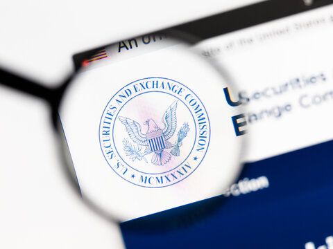 Milan, Italy 2026, 15 AGO Closeup of Securities and Exchange Commission SEC website page on a laptop screen. Focus on Securities and Exchange Commission SEC logo under a magnifying glass.