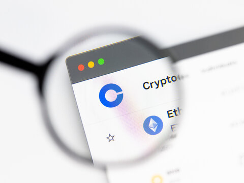 Milan, Italy 2026, 15 AGO Closeup of Coinbase website page on a laptop screen. Focus on Coinbase logo under a magnifying glass.