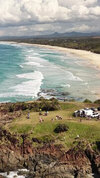 Hastings Point coastline from above, rocky point and golden sand, NSW Australia - vertical video
