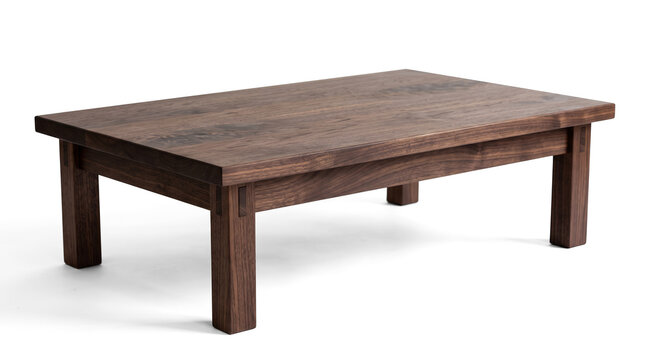 Minimalist Japanese-inspired walnut table emphasizing precision joinery and understated craftsmanship.