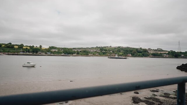 Scenic harbour of Fenit village on the coast of County Kerry, surrounded by green hills and the waters of Tralee Bay on Ireland Wild Atlantic Way - County Kerry, Ireland - 31 August 2026.