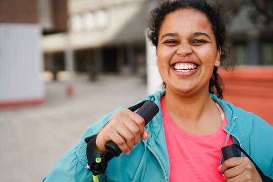 Curvy african american woman doing workout exercise outdoor - Sport and healthy lifestyle for plus size people concept - Focus on girl face - UGC content